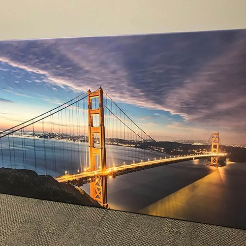 A business using wall murals to create a stunning image of the Golden Gate Bridge on their office wall