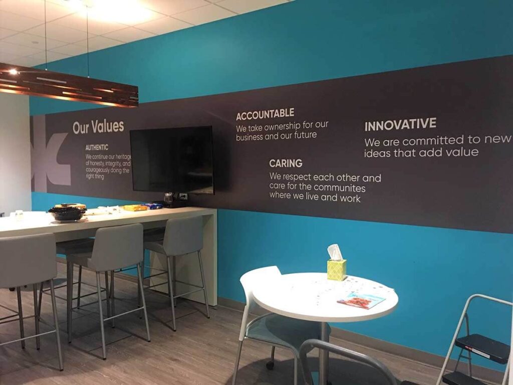 Custom graphics displaying company values helps establish the tone for a community reception area.