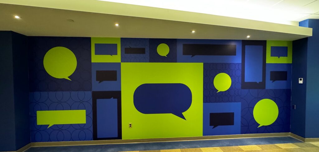 This business is using wall murals to depict a bunch of chat bubbles in their office, hopefully creating and Instagram-worthy experience for office visitors